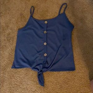 blue tank top knotted at the bottom